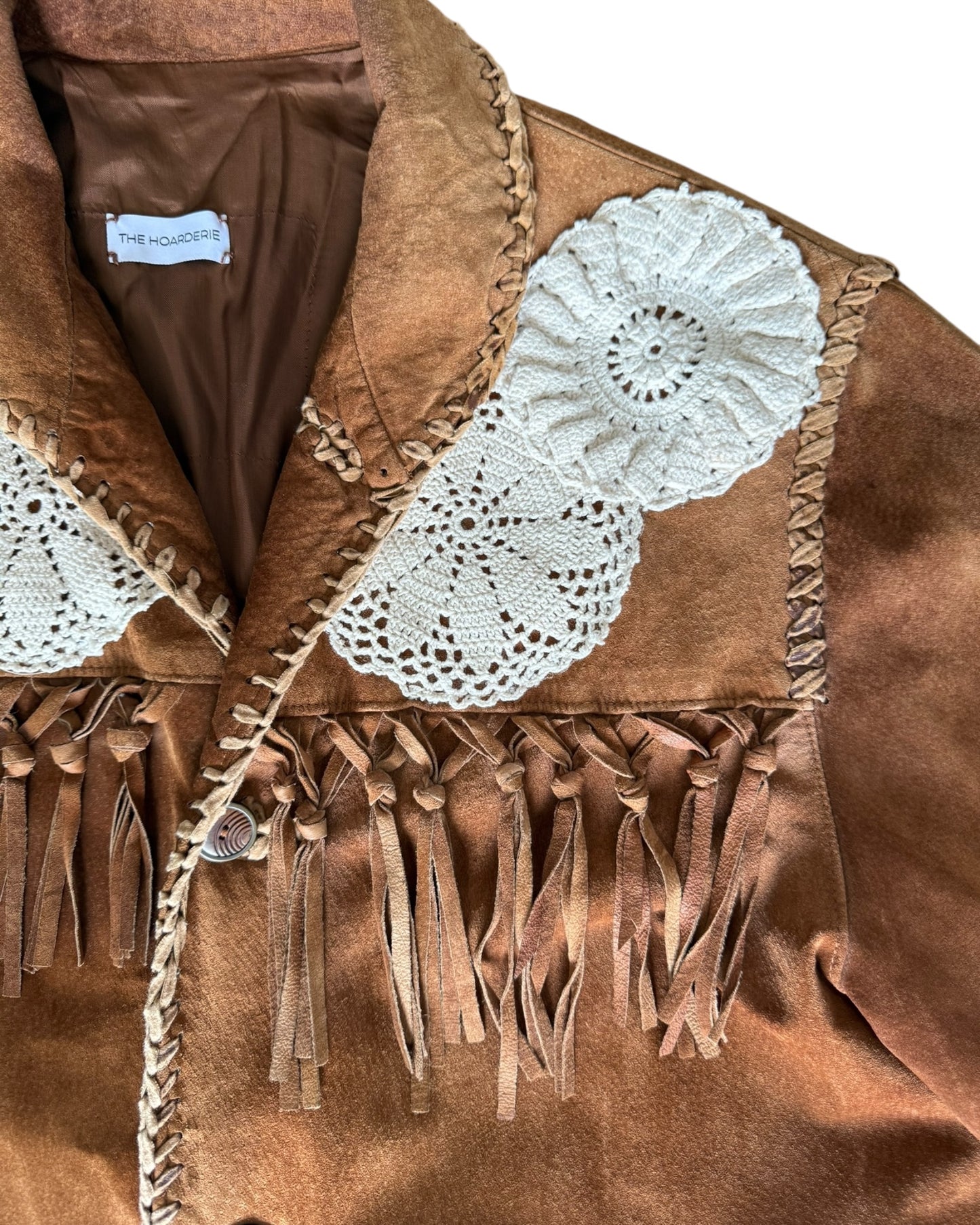 Brown fringe leather jacket with crochet appliqués